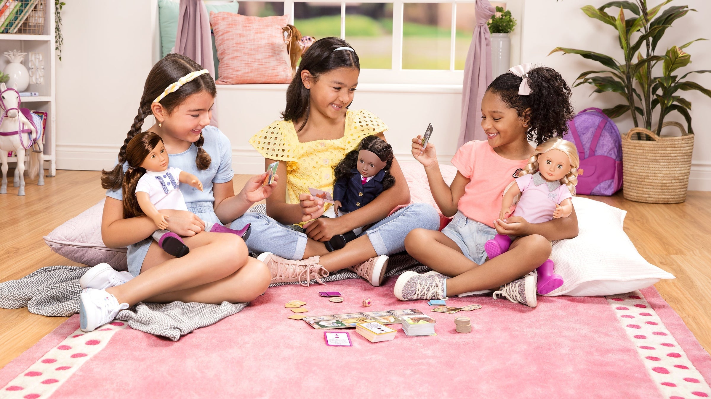 A diverse group of young Girls are playing with dolls