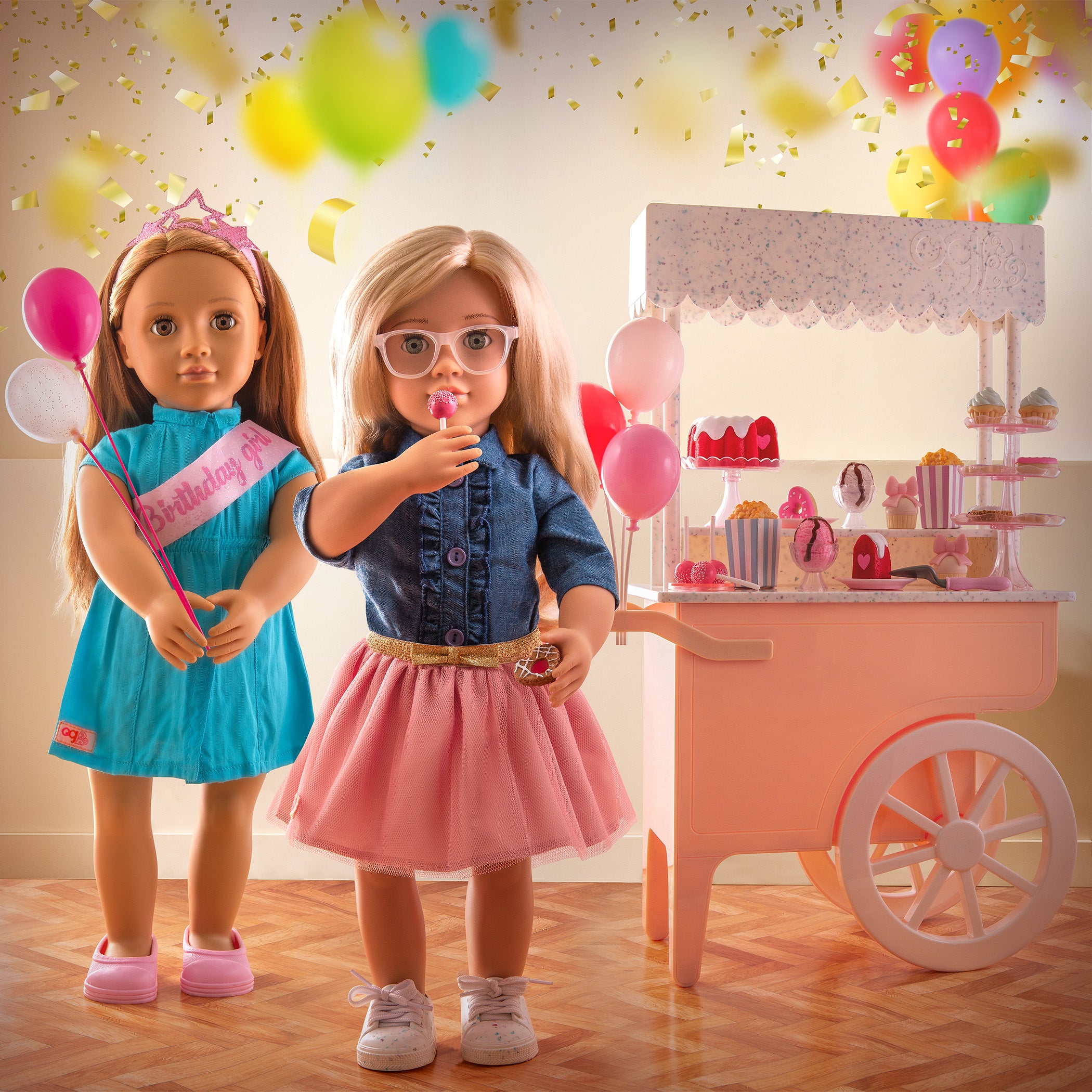 Two girl dolls with a sweet cart celebrating a birthday 