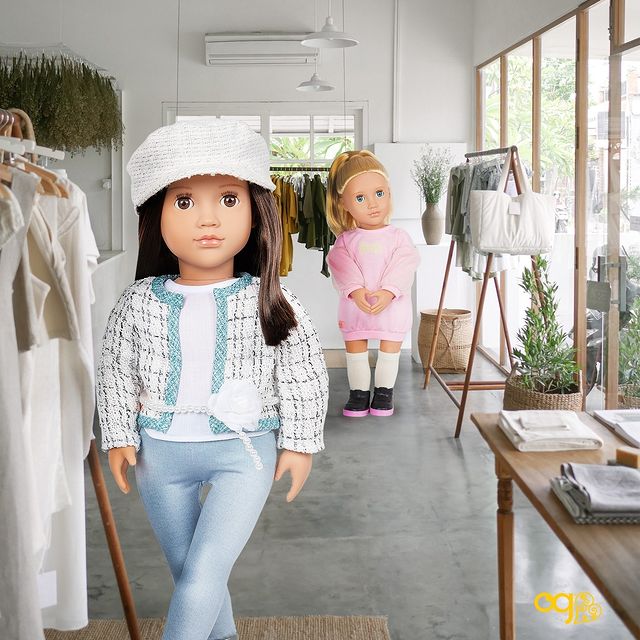 Dolls in a store shopping for clothing 