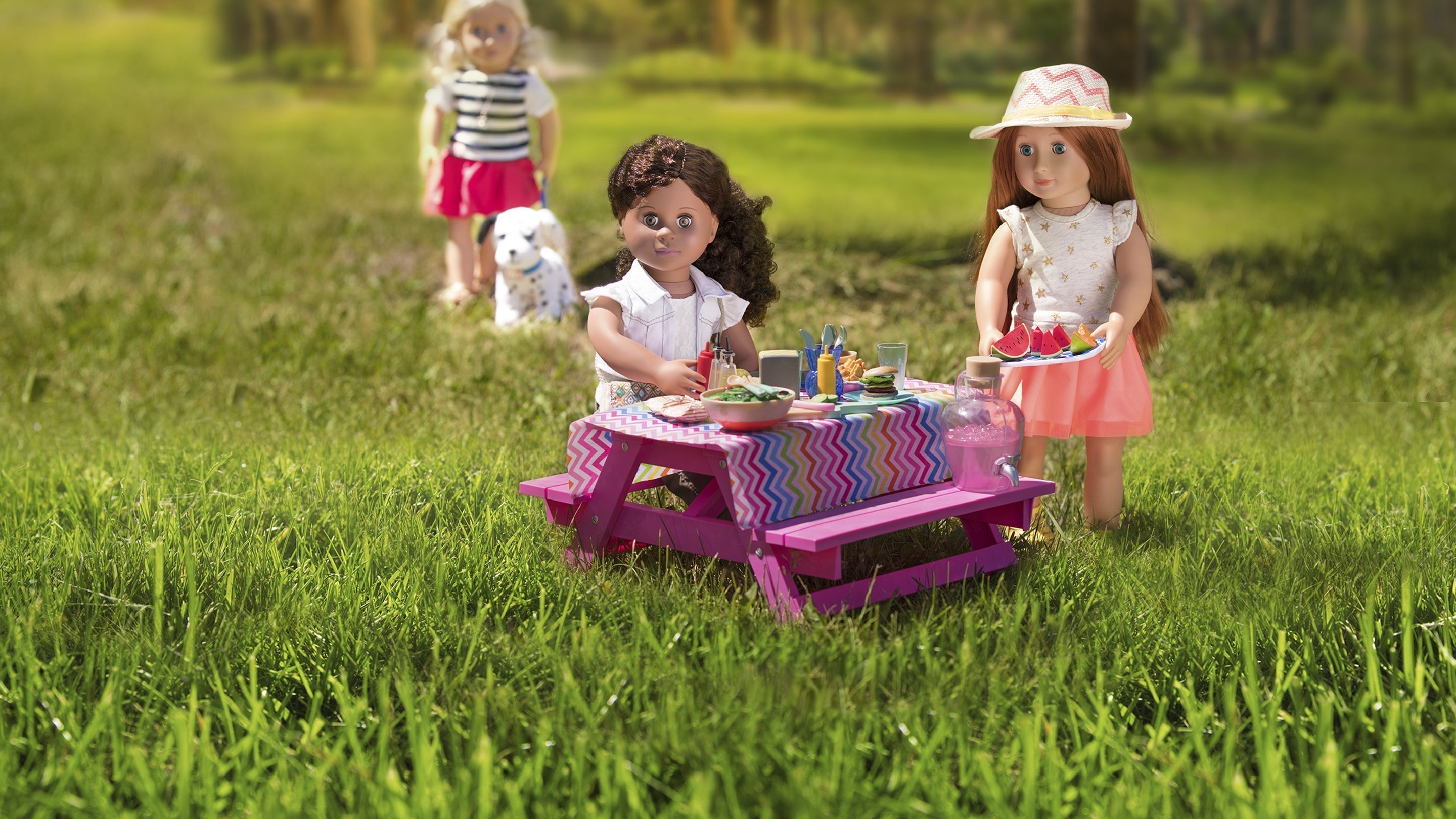 Dolls having snacks at a picnic table