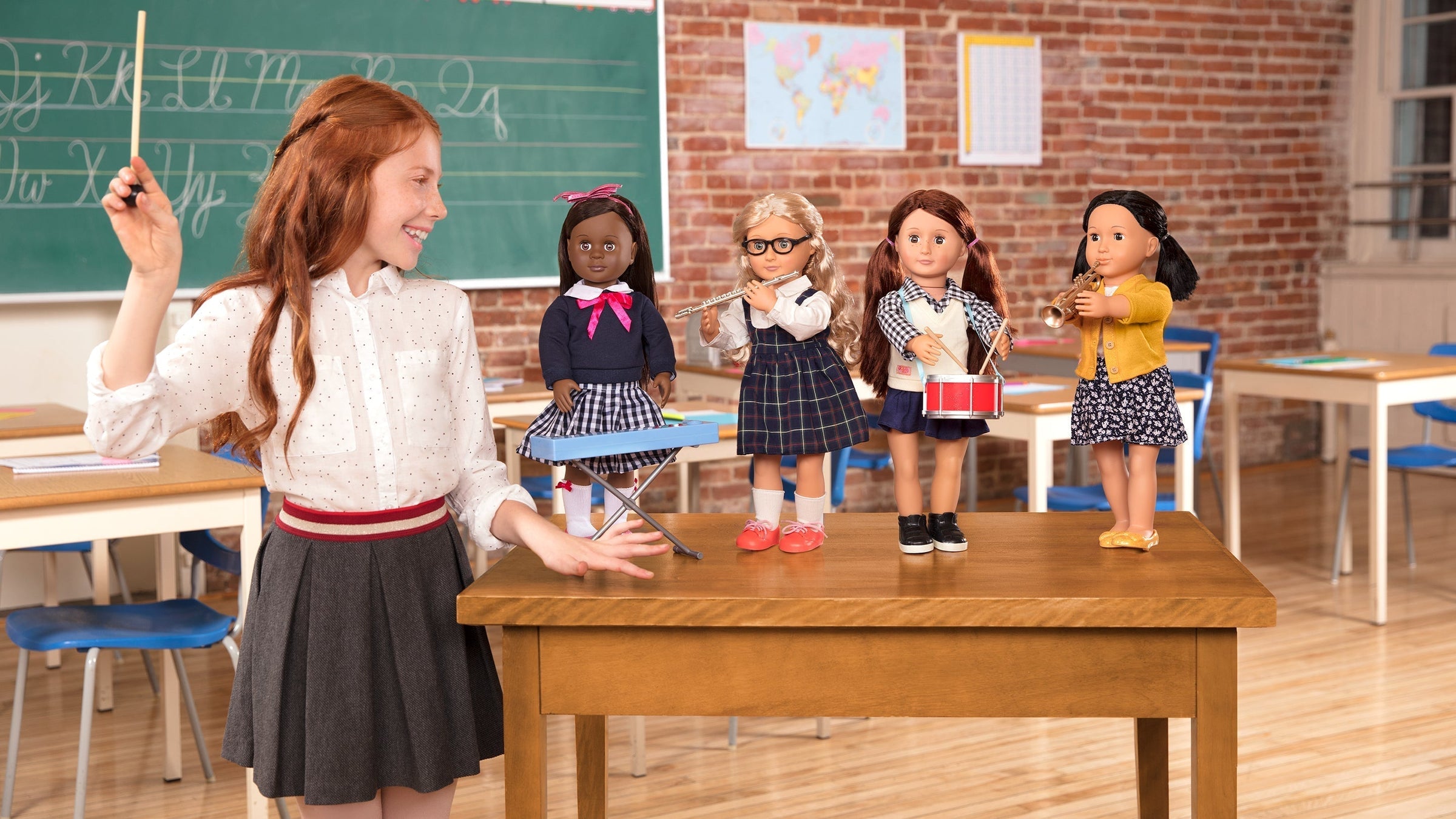 Girl playing with dolls in classroom