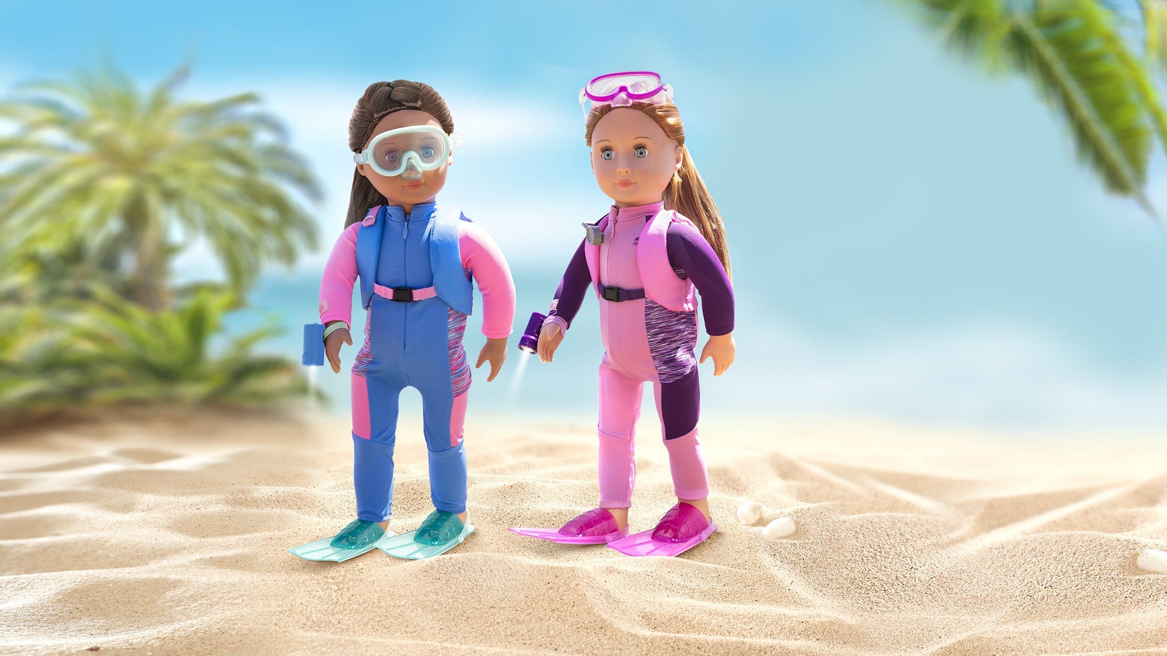 Two dolls wearing wetsuits and swimming equipment