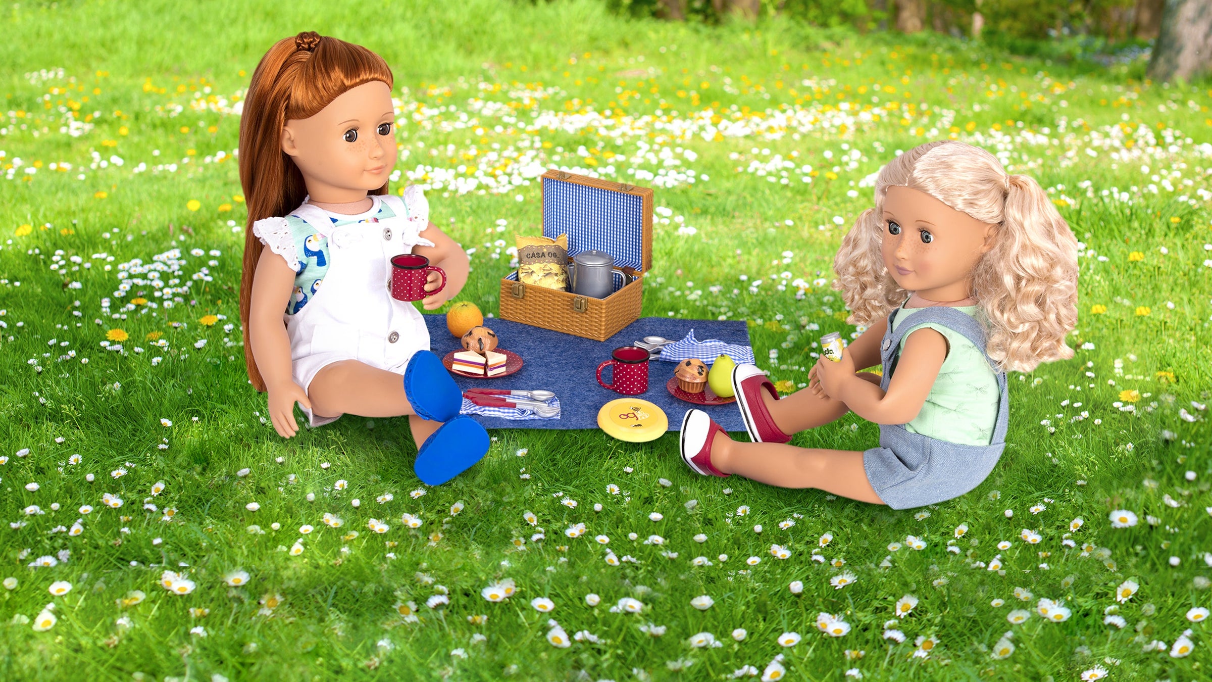Two Dolls enjoying Picnic in the park with a Picnic Basket and Food