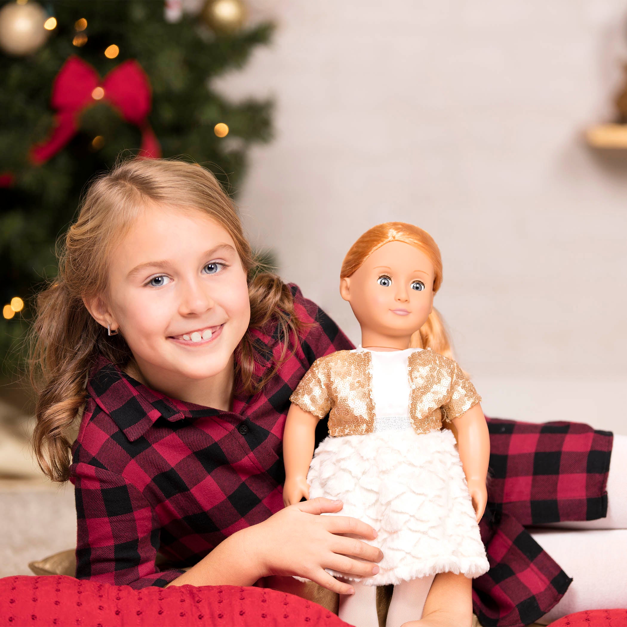 18-inch holiday doll with strawberry-blonde hair and gray eyes
