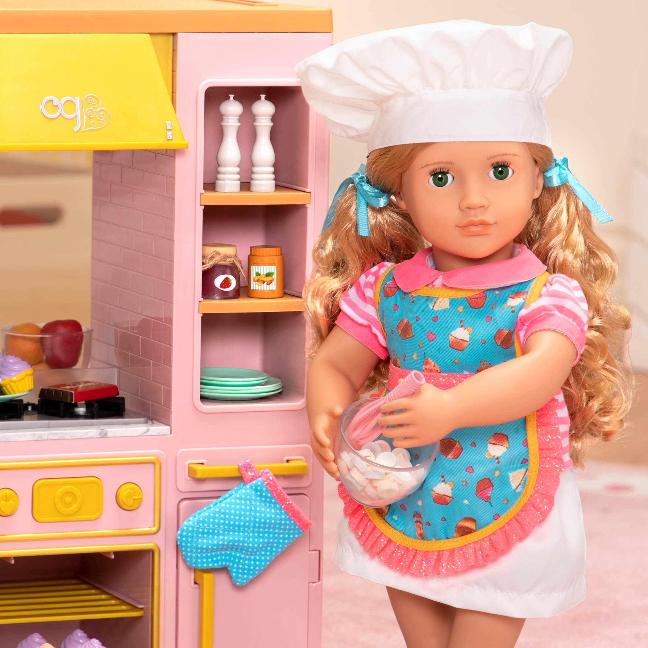 18-inch doll with blonde hair, green eyes, baking accessories and storybook
